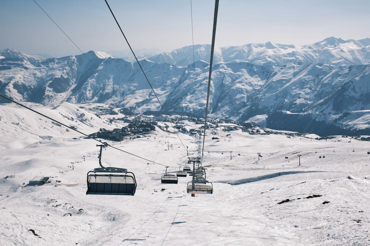 Chair lifts above snowy slopes at Gudauri