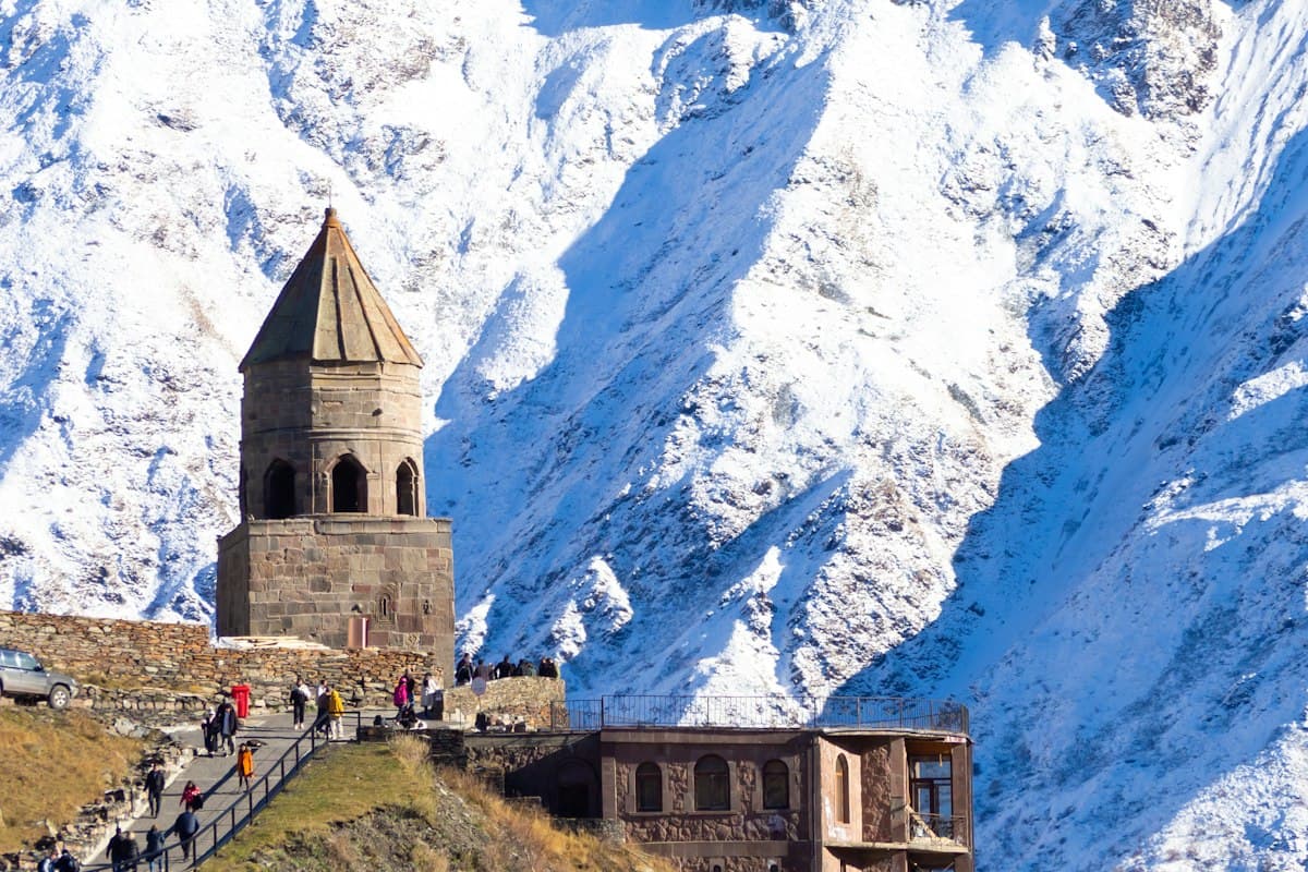 Gergeti Trinity Church with snow-covered Mount Kazbek behind